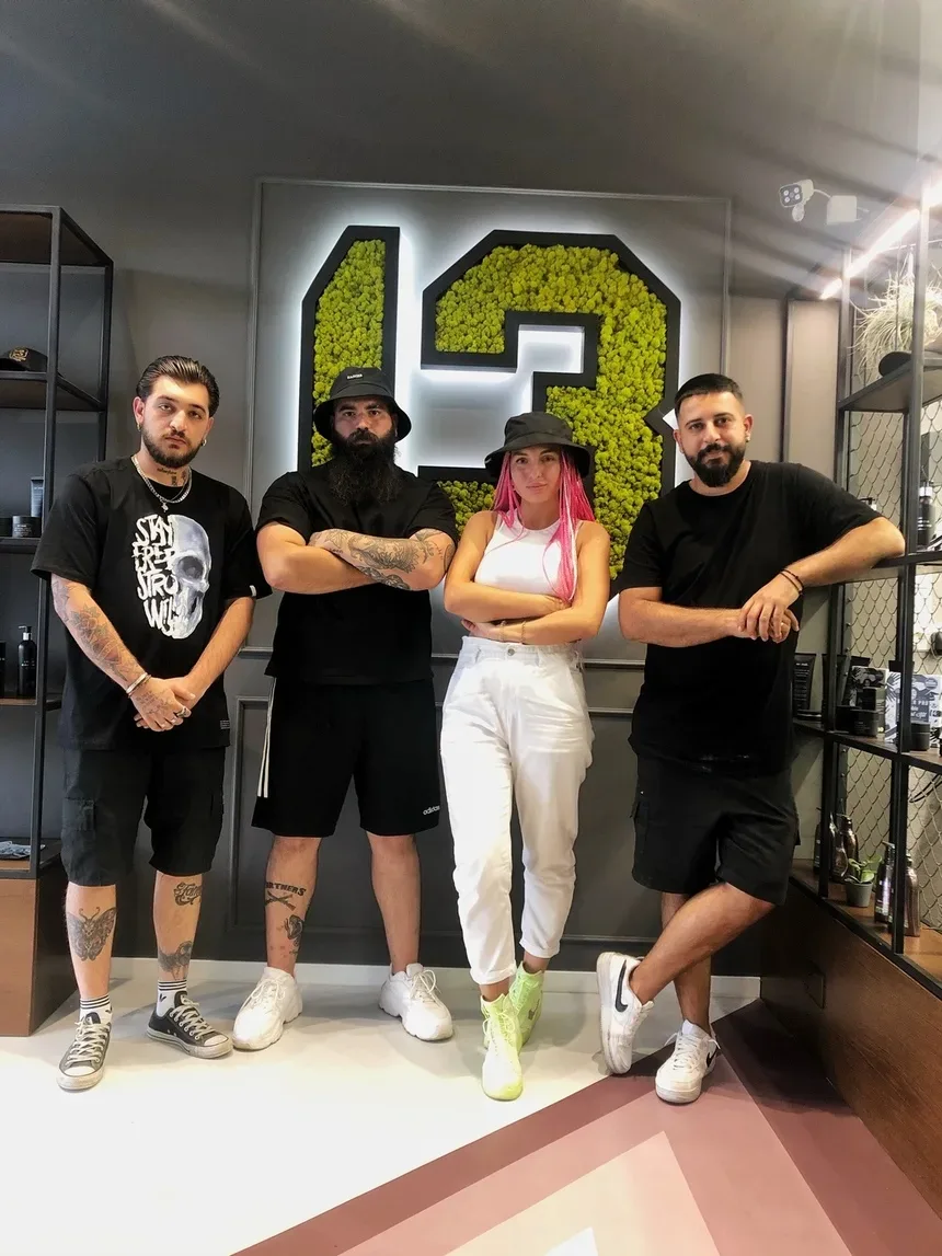 Команда студии 13 by Black Star в интерьере барбершопа