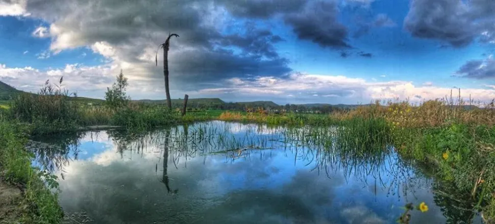 Image may contain: cloud, sky, outdoor, nature and water
