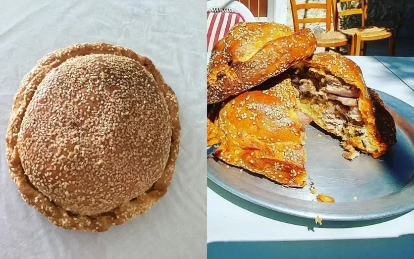 Нарезанные ломтики Флаунес с оливками и сыром на пергаменте Нарезанные ломтики Флаунес с оливками и сыром на пергаменте